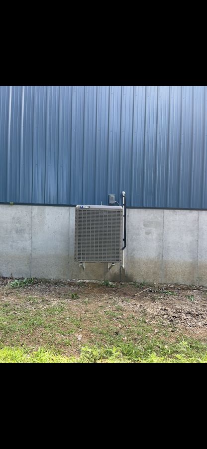 Outdoor AC condenser after service at a central Missouri home